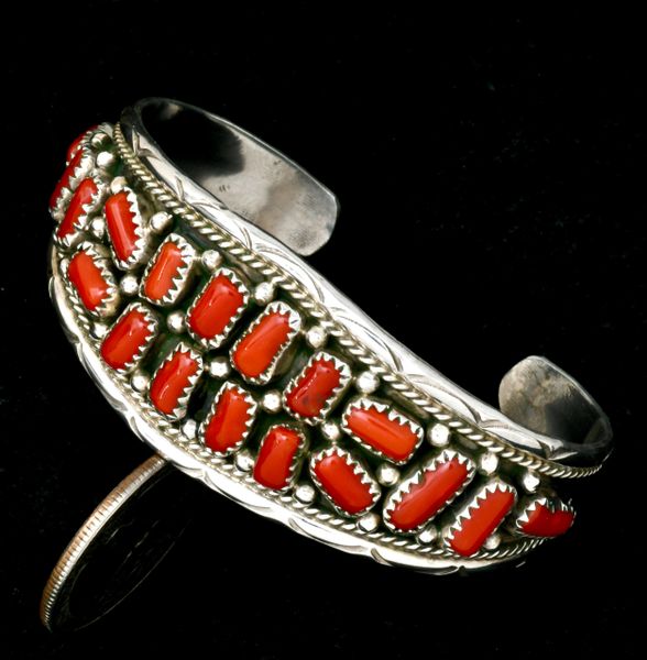Smallish wrist-size Navajo cuff with 18-pieces of Mediterranean red coral. #2367a