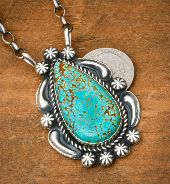 Navajo everse-stamped repousse' pendant with No. 8 Mine turquoise, by Jeff James, Jr.