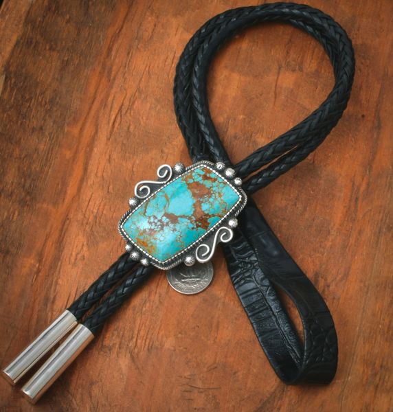 Top shelf No. 8 Mine turquoise Navajo trophy bolo tie by Landon Secatero. #2500