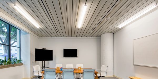 Ceiling mounted LANTANA LED light fixtures in conference room