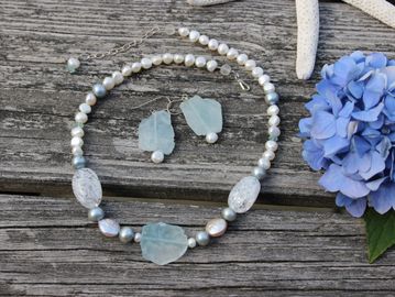 Necklace is made with slices of Topaz, crystals and pearls.  Necklace regularly $120.00 now 40% off 