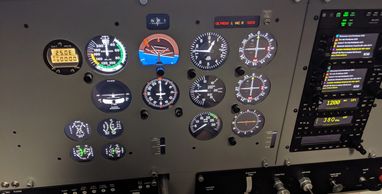 The Steam Gauge configuration for the Frasca RTD with a dual GNS 430W panel on the right on a Cessna 172.