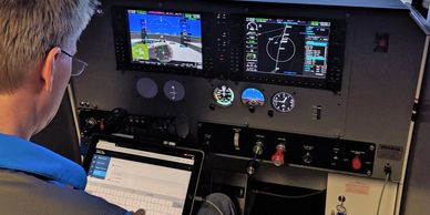A pilot resetting his start location using his own tablet wirelessly connected to the simulator.