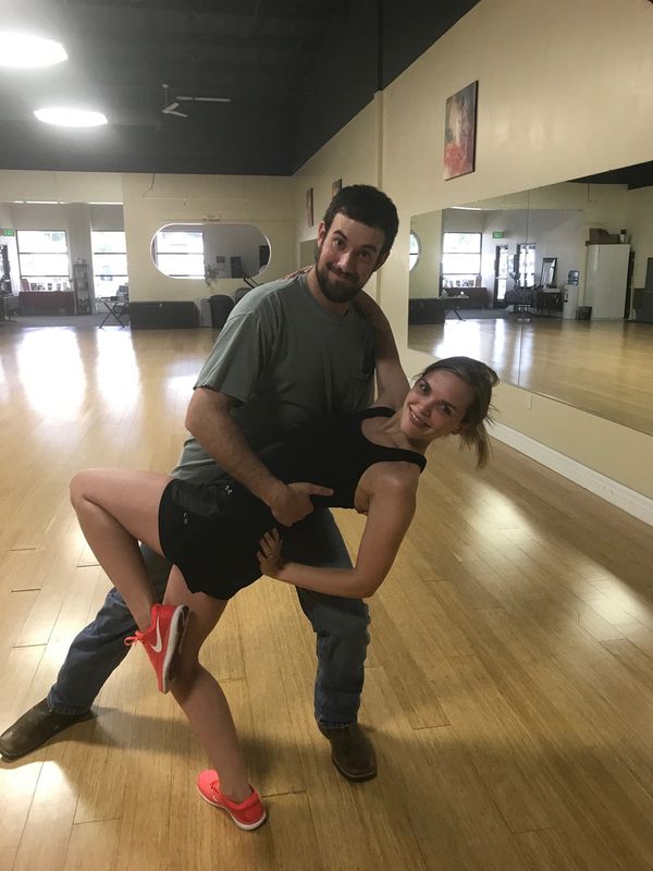 Couples practicing wedding dance