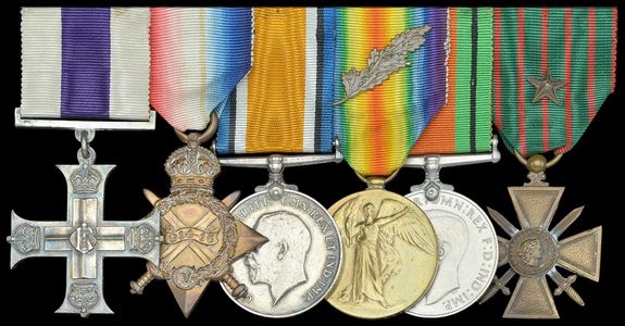 A collection of six military medals with colorful ribbons, displayed against a black background.