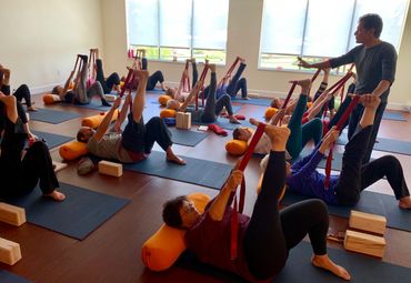 Students in class with Francisco Kaiut at Broomfield Yoga Studio 