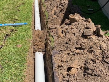 By installing French drain helps all that standing water in backyard to be out to the street less mu