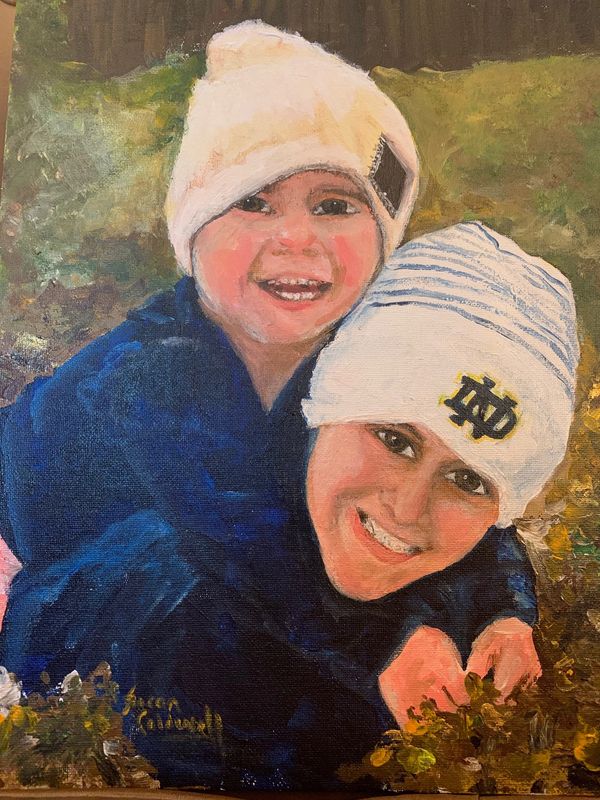 Two children playing in the fall leaves portrait by Susan Caldwell