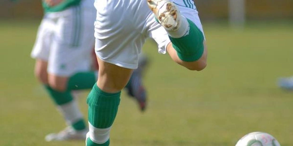 The hamstring muscles of a footballer's left leg