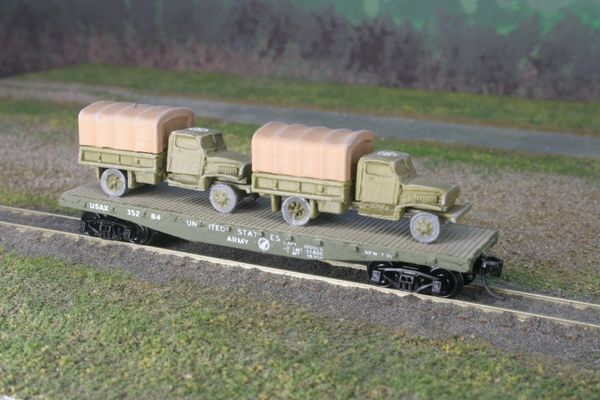 (2) Chevrolet 1 1/2 Ton Cargo Trucks on US Army Transportation Corp Flat Car