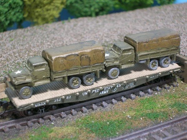 (2) Chevrolet 2 1/2 Ton Cargo Trucks on US Army Transportation Corp Flat Car