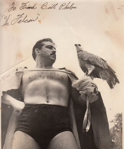 John Calvert posing with a falcon