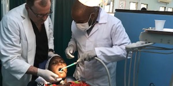Dr Frank Bald assisting in Tanzania Africa Dental group