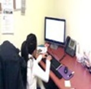 Shileta working at her desk who found success in the Ticket to Work Program.