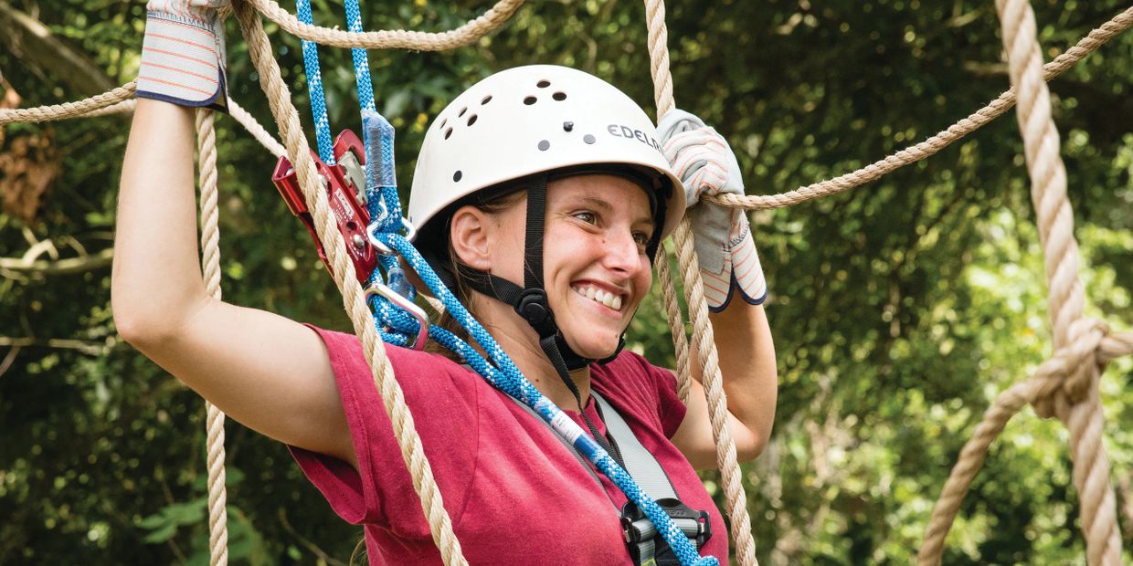 Summer camp high ropes course activity.