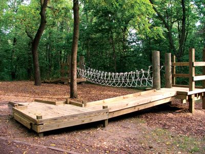 Wheelchair accessible low ropes course for guests with special needs.