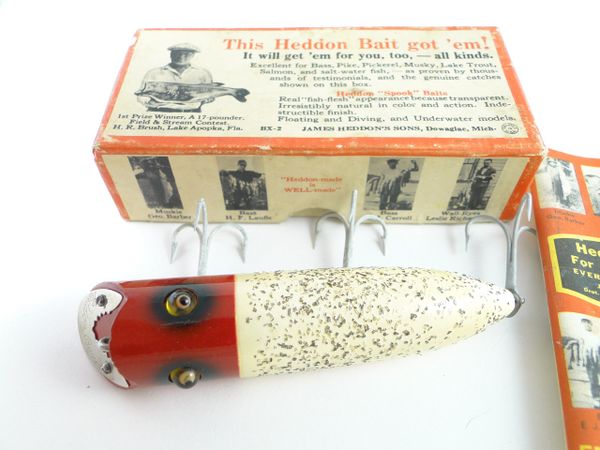 This 4 antique Heddon Basser wood fishing lure is from the 1920s and has  paint wear.