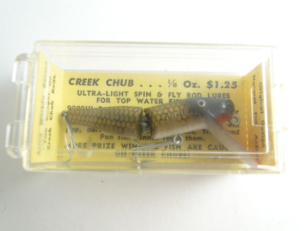 6 1/2 Creek Chub, jointed Pikie with plastic eyes, Rapalas, Red Eye,  Jitterbug and more in a plastic tackle box in poor condition - AAA Auction  and Realty