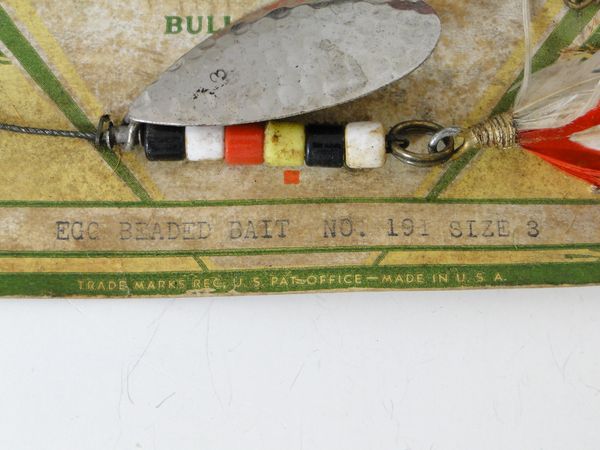 This old wood fishing lure is a Pflueger Globe and it comes with the  original box.This large lure was probably used for Musky fishing as it  measures over 5" long and the box 8 1/2" long. - Antique Mystique