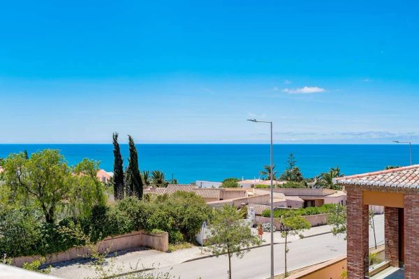 Clear sky and sea view over suburban houses.