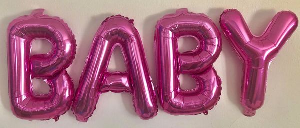 Pink letter shop balloons