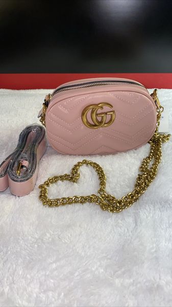 Pink Gucci Fanny pack with gold chain and belt
