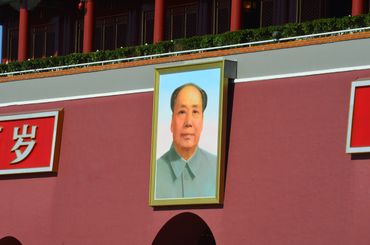 Portrait of Mao Zedong on a red wall at Tiananmen Square.