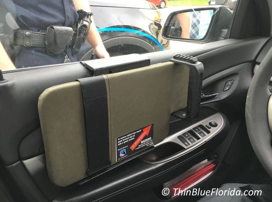 The Riggs Shield mounts on the inside of a patrol car door for immediate deployment.