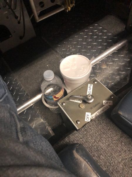 The humble airplane cup holder