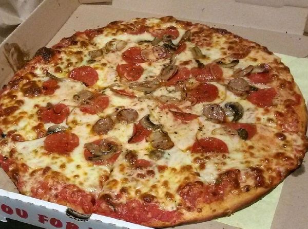 Fresh pepperoni, meatball, and mushroom pizza