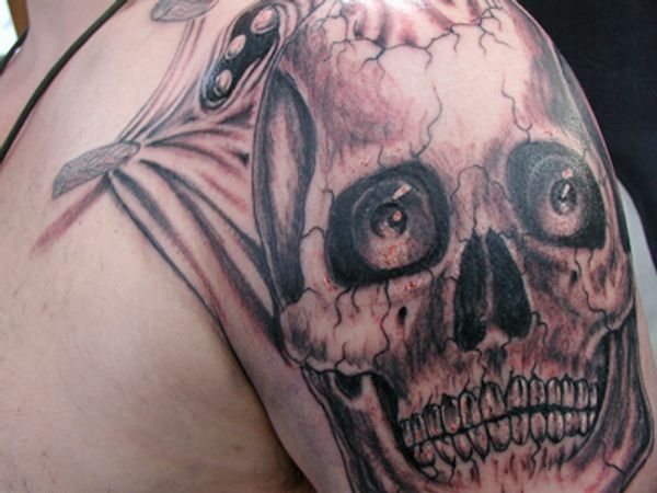 Black and grey skull tattoo.