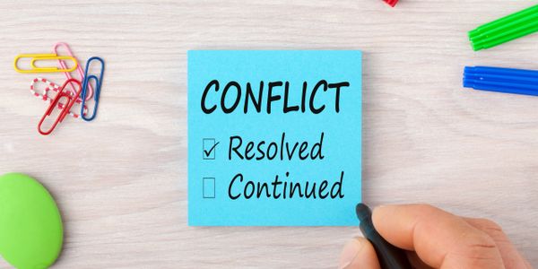 Post-it note showing conflict resolved