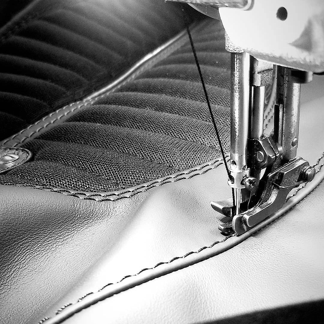 Motorcycle seat cover being sewn