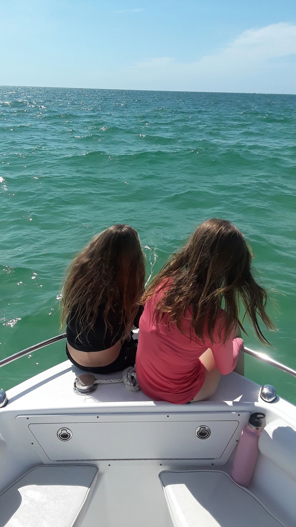 Sitting on the bow of boat in the Gulf Of Mexico