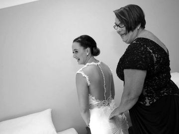Mother of bride helping transform her daughter into the perfect bride.