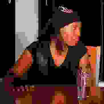 a rough character with a biker look about her
