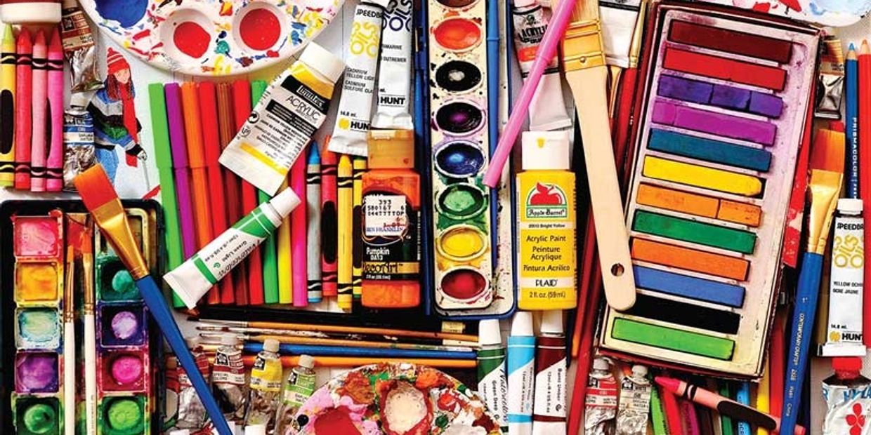 colorful image of paint supplies including brushes and various paint colors