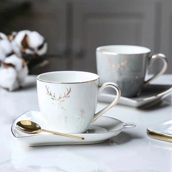 Ceramic Coffee / Tea Cup with a ring shape saucer and golden spoon