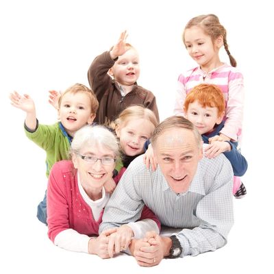 An elderly couple with grandkids seeing the benefits of their retirement planning in Bloomfield Hill