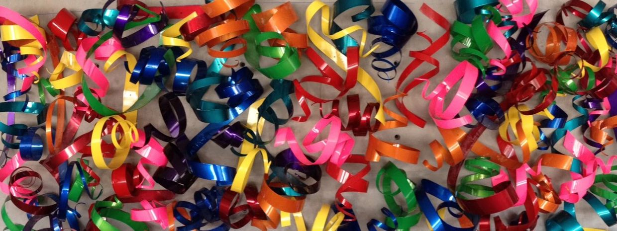 Colorful curled ribbons spread out.