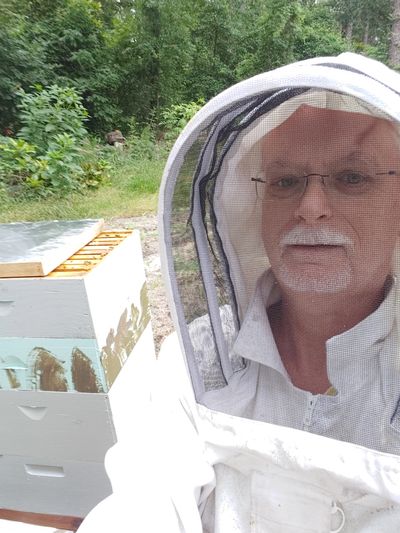 Donald Dees, owner of Dees Bees Apiary working in the field.