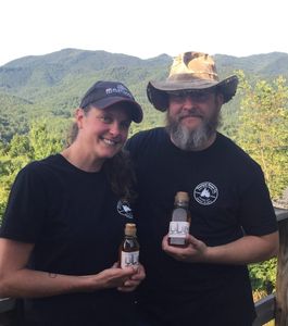 Amy and Ken Kashuba of Hot Springs, NC showing off their recently purchased Dees Bees raw honey.