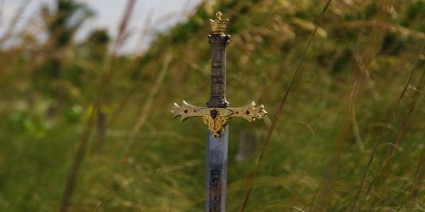 Inverted European sword in a country field