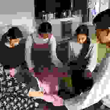 Family praying in home