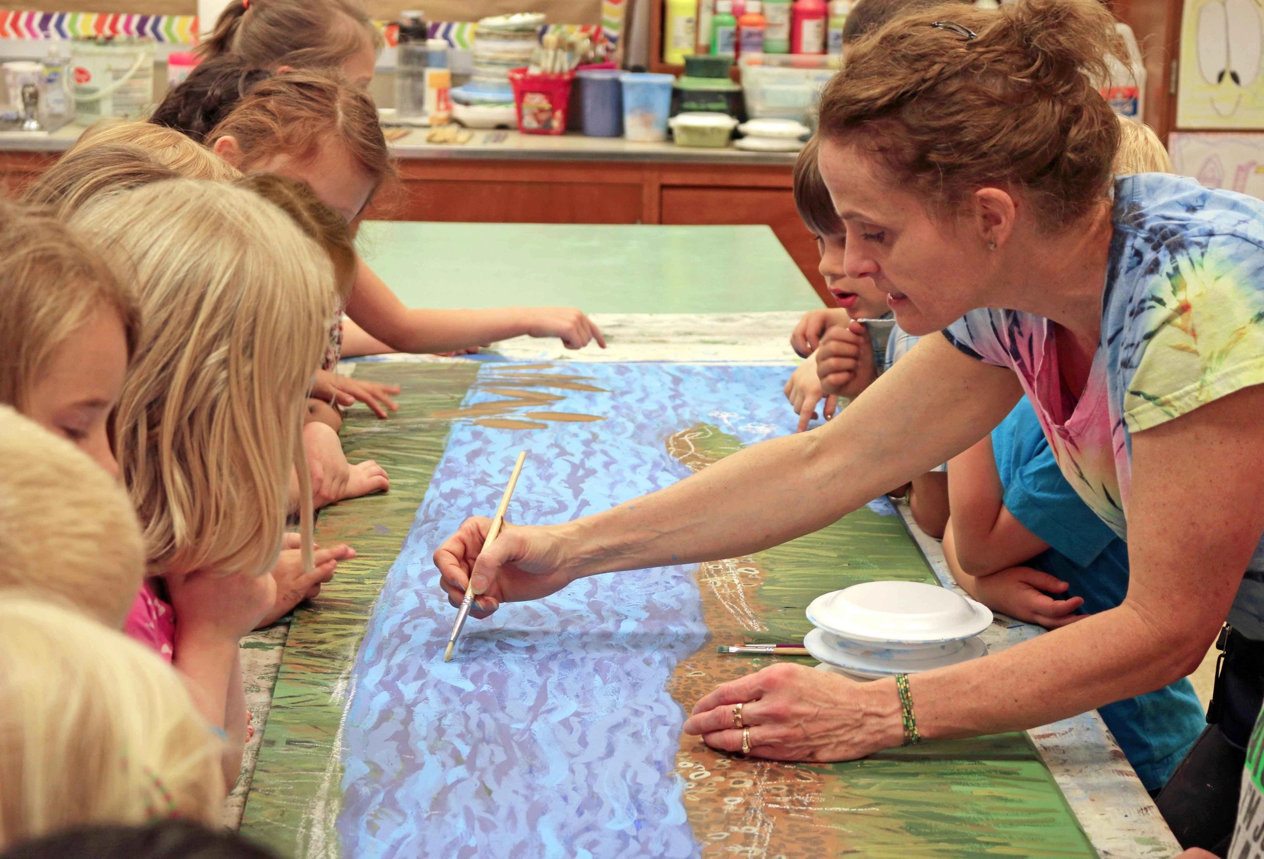 Cape St. Claire Elementary students work with artist Gayle Mangan Kassal to create a mural