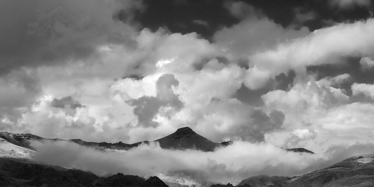 B&W images of mountains and stormy clouds. Owyhee Mnt in Southern Idaho by David Wuerth photography