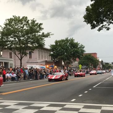 vintage cars driving in watkins glen