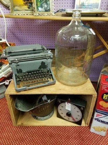 Antique typewriter with clock and glass