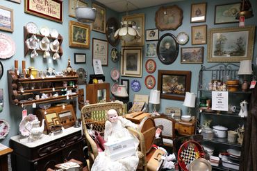 Antiques beautifully arranged in Heirloom Antique Mall store room