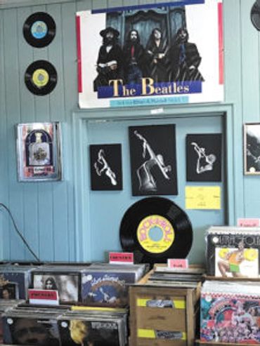 Vinyl records on walls and shelves